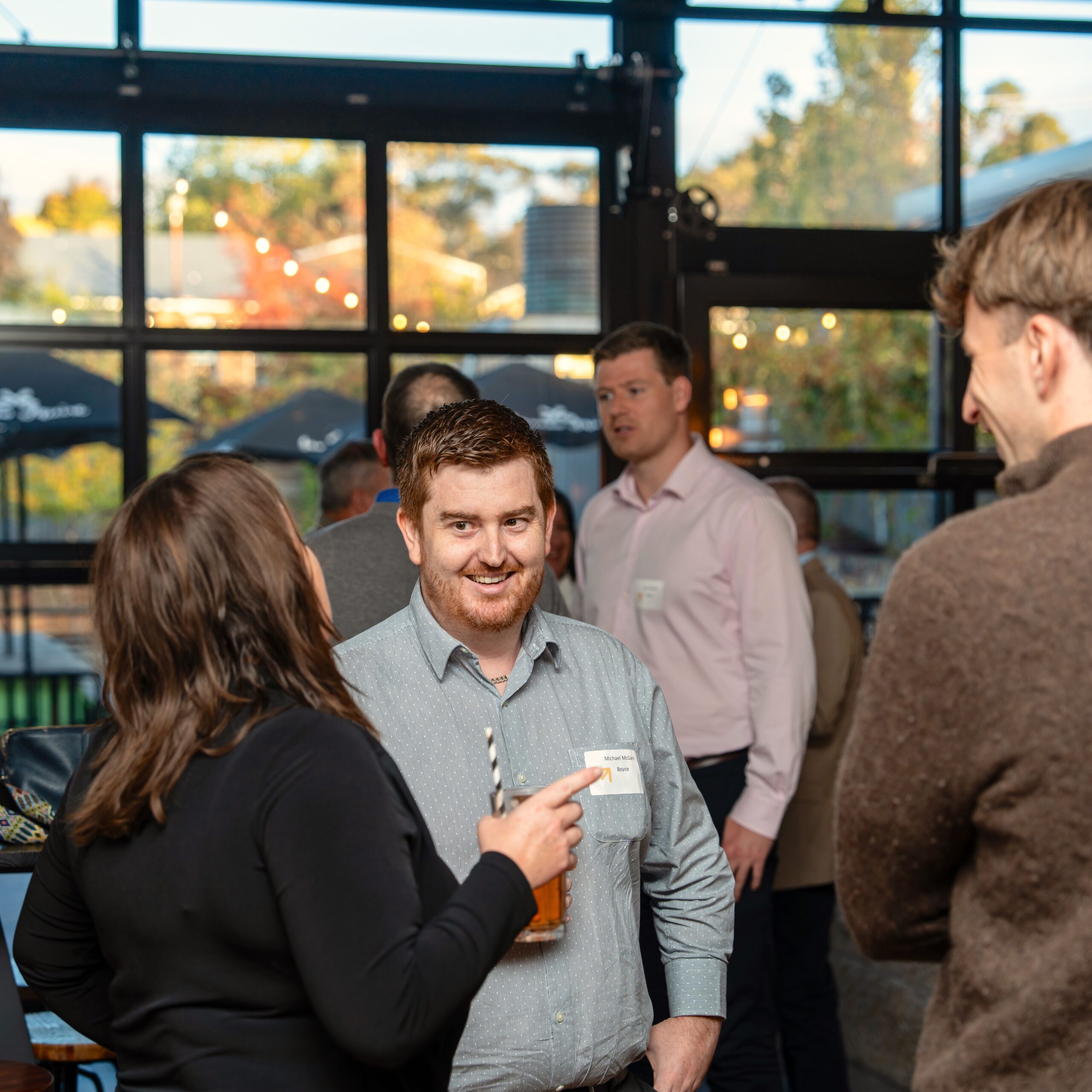 man smiling with colleague